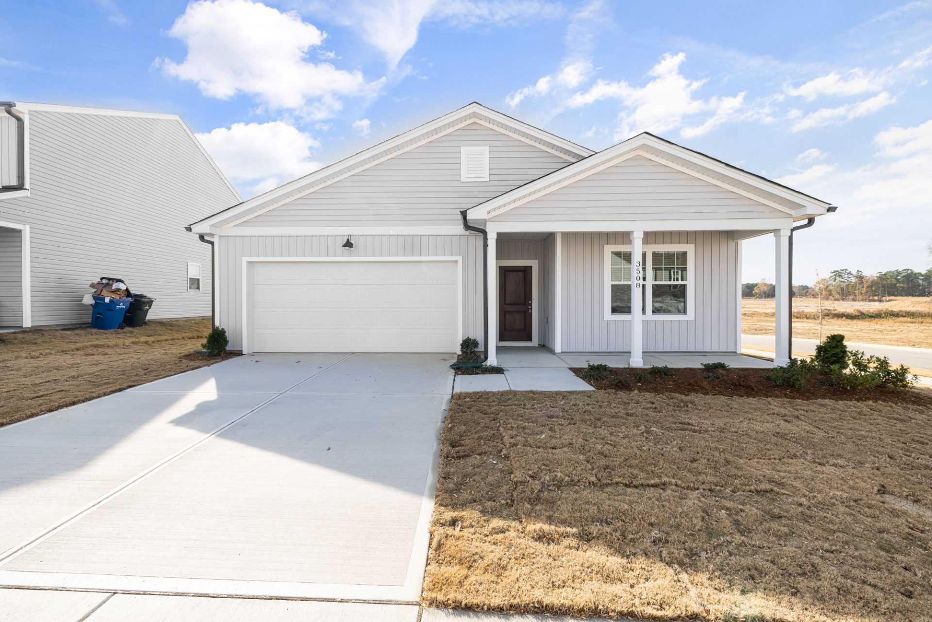 Single-story home with a covered front porch and two-car garage